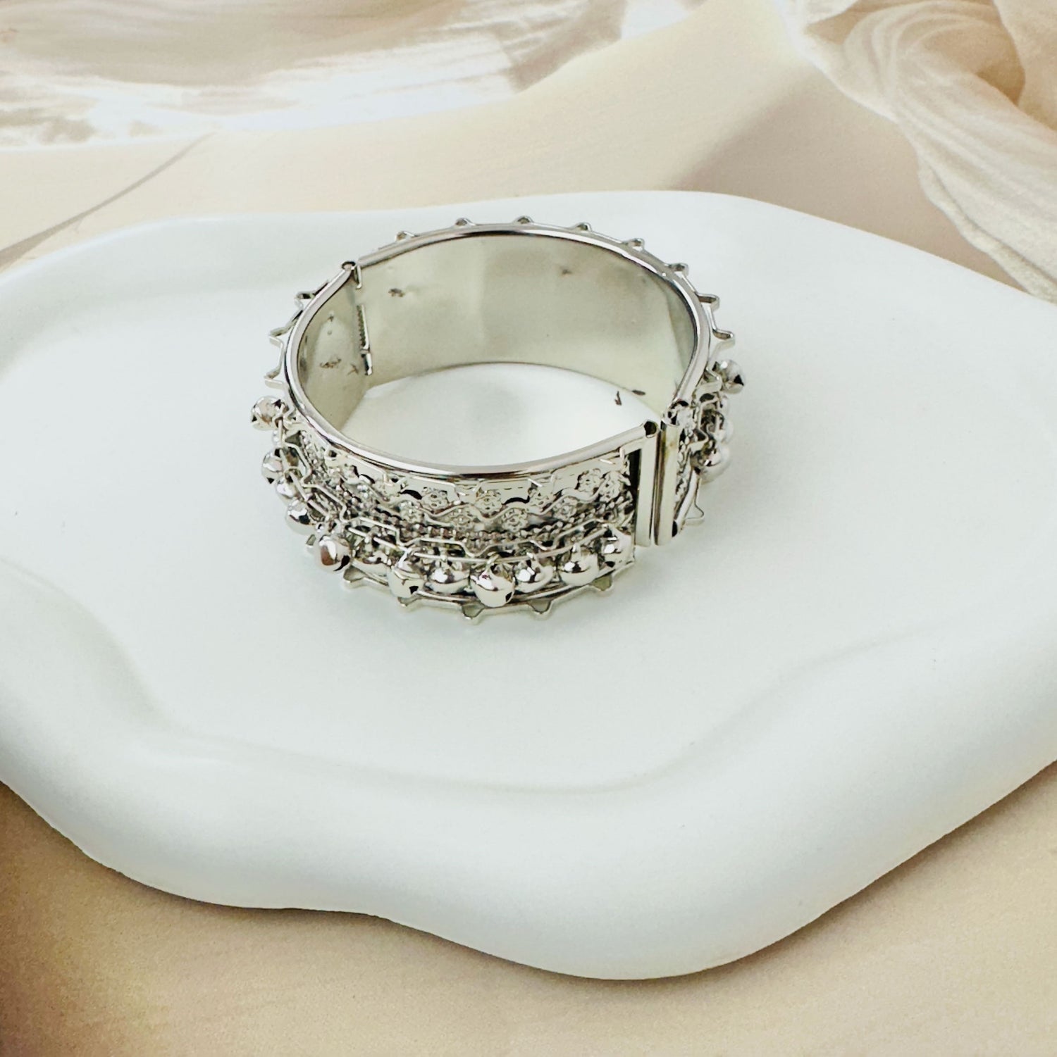 Ornate Silver-Tone Hinged Cuff Bracelet with Chain Details