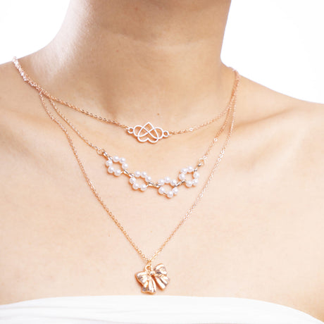 Rose Gold Triple-Layer Necklace with Heart and Bow Accents