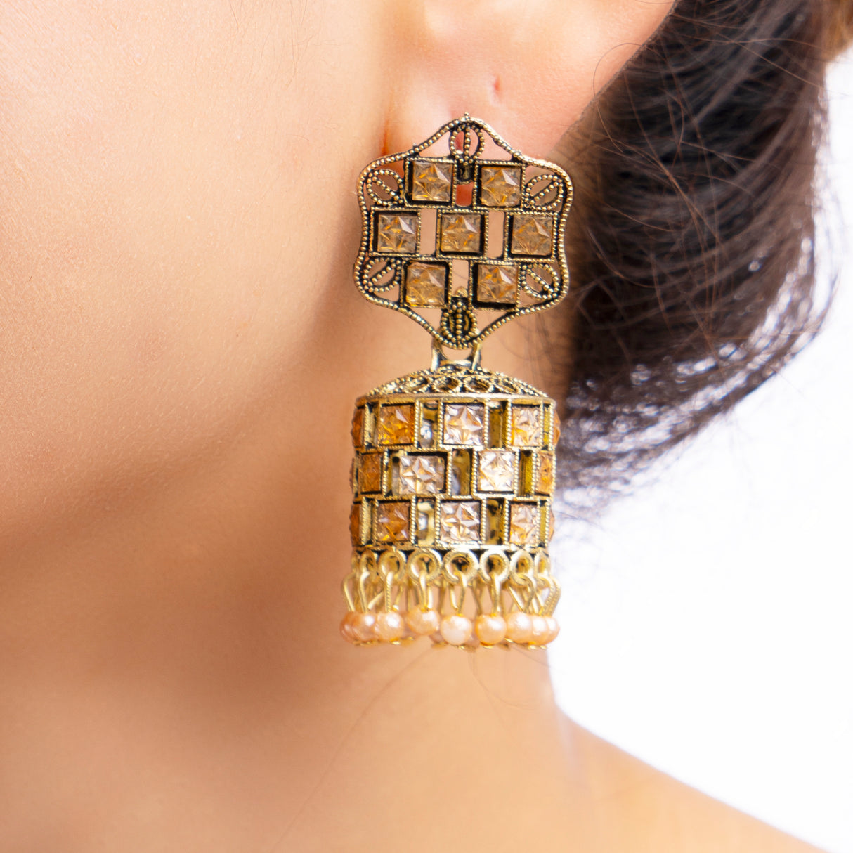 Antique Gold-Toned Jhumka Earrings with Stone Accents