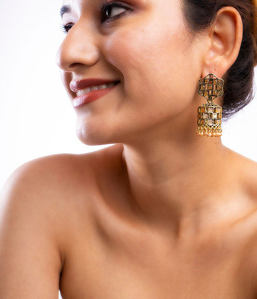 Antique Gold-Toned Jhumka Earrings with Stone Accents