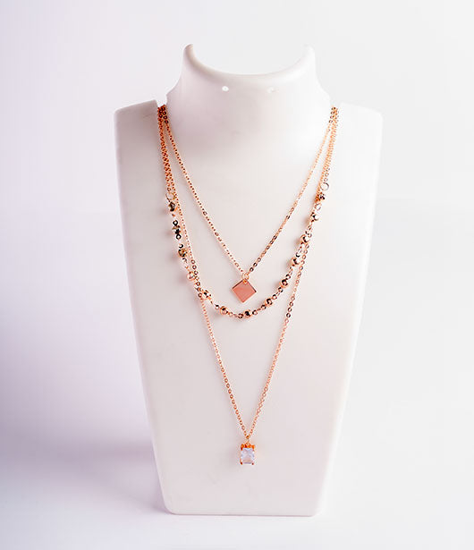 Rose Gold Triple-Layered Necklace with Geometric Charms