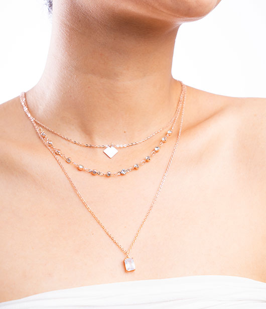 Rose Gold Triple-Layered Necklace with Geometric Charms