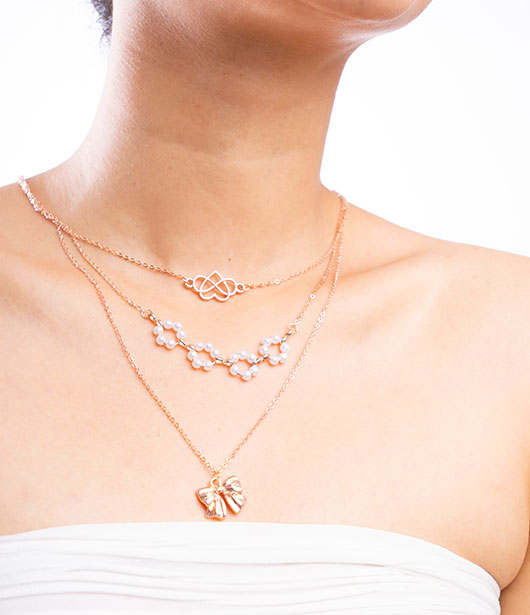 Rose Gold Triple-Layer Necklace with Heart and Bow Accents